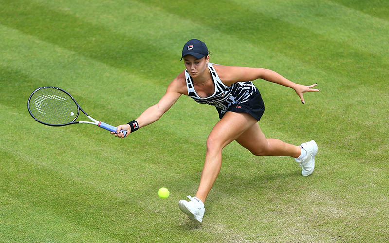 Ash Barty reaches for a forehand