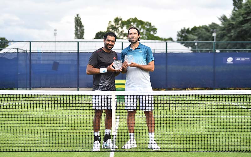 Santiago González and Aisam-ul-Haq Qureshi pose after winning the men's doubles
