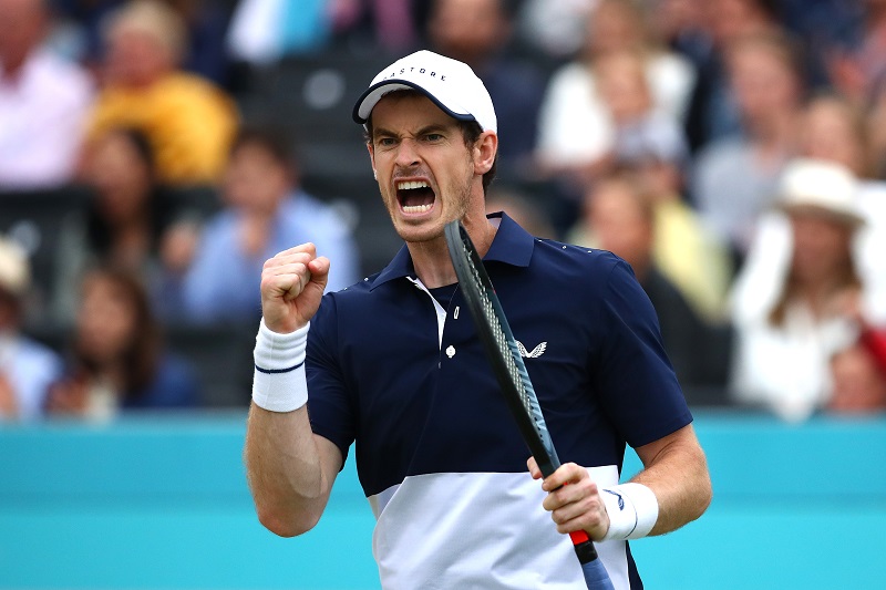 Andy Murray celebrates winning a point in the mens doubles final