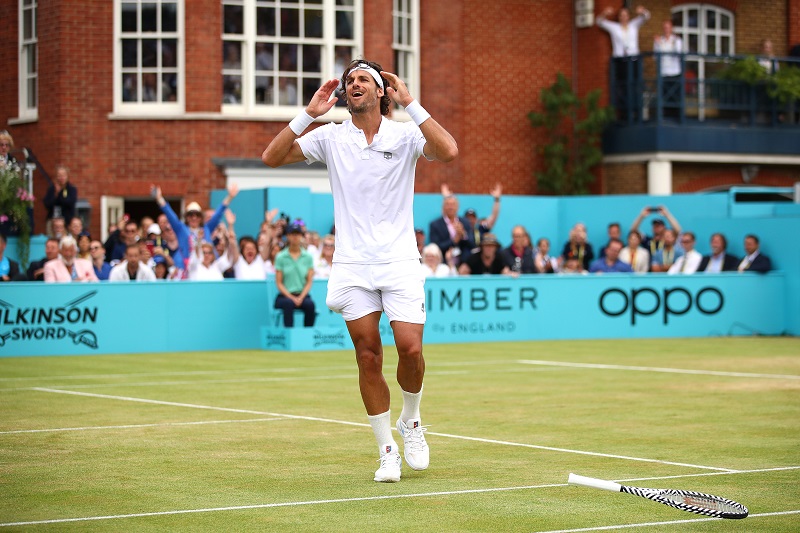 Feliciano Lopez celebrates match point during the mens singles final