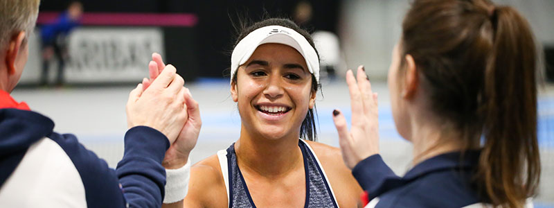 Heather Watson celebrating with teammates at 2017 Fed Cup in Estonia