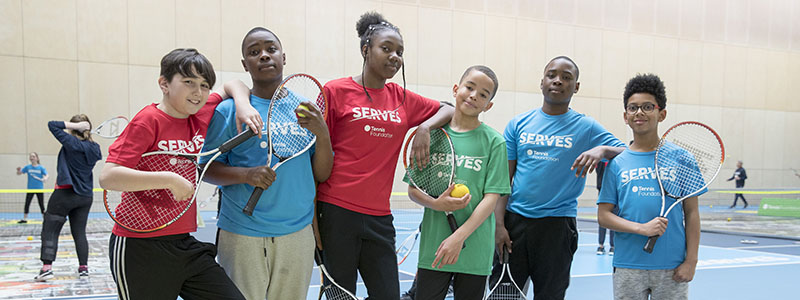 Kids take part at a SERVES Tennis Festival 